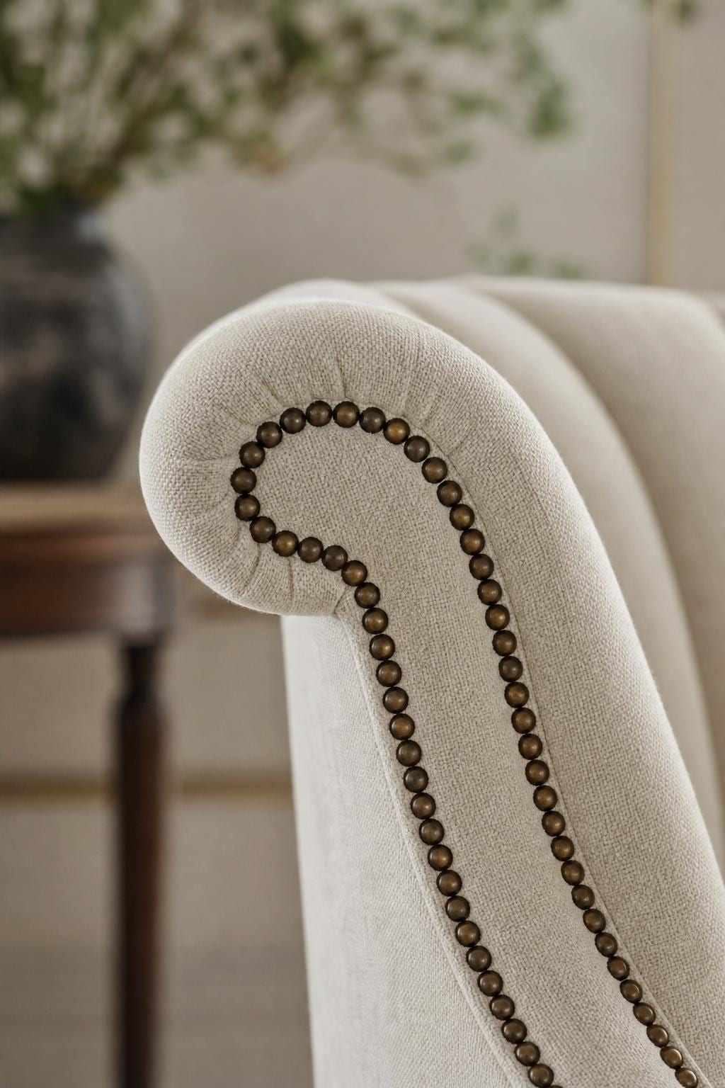 Tailored linen upholstery and walnut frame on a Baker lounge chair