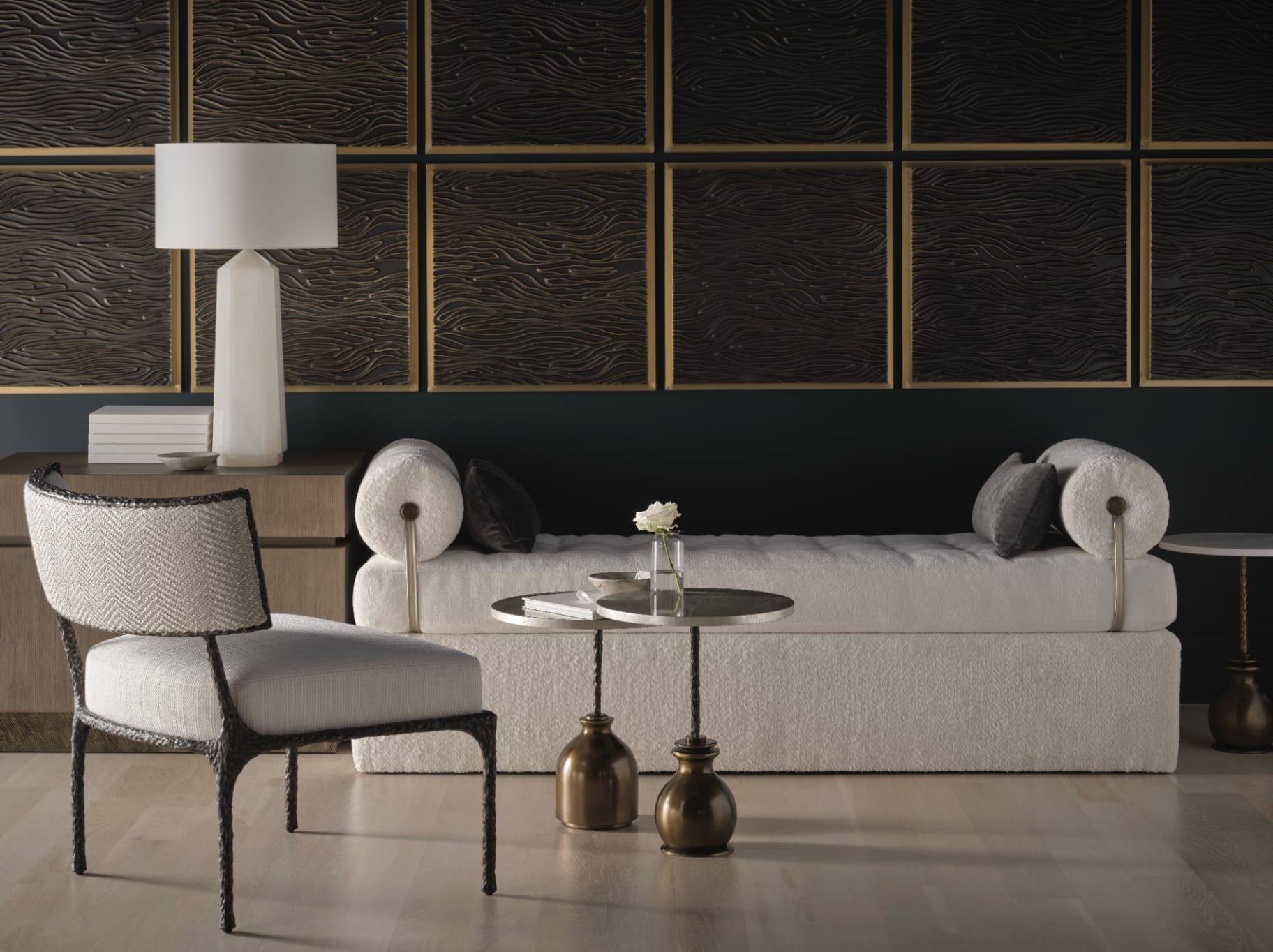 A layered American interior — sculpted hardwood, tailored upholstery, woven natural fibre
