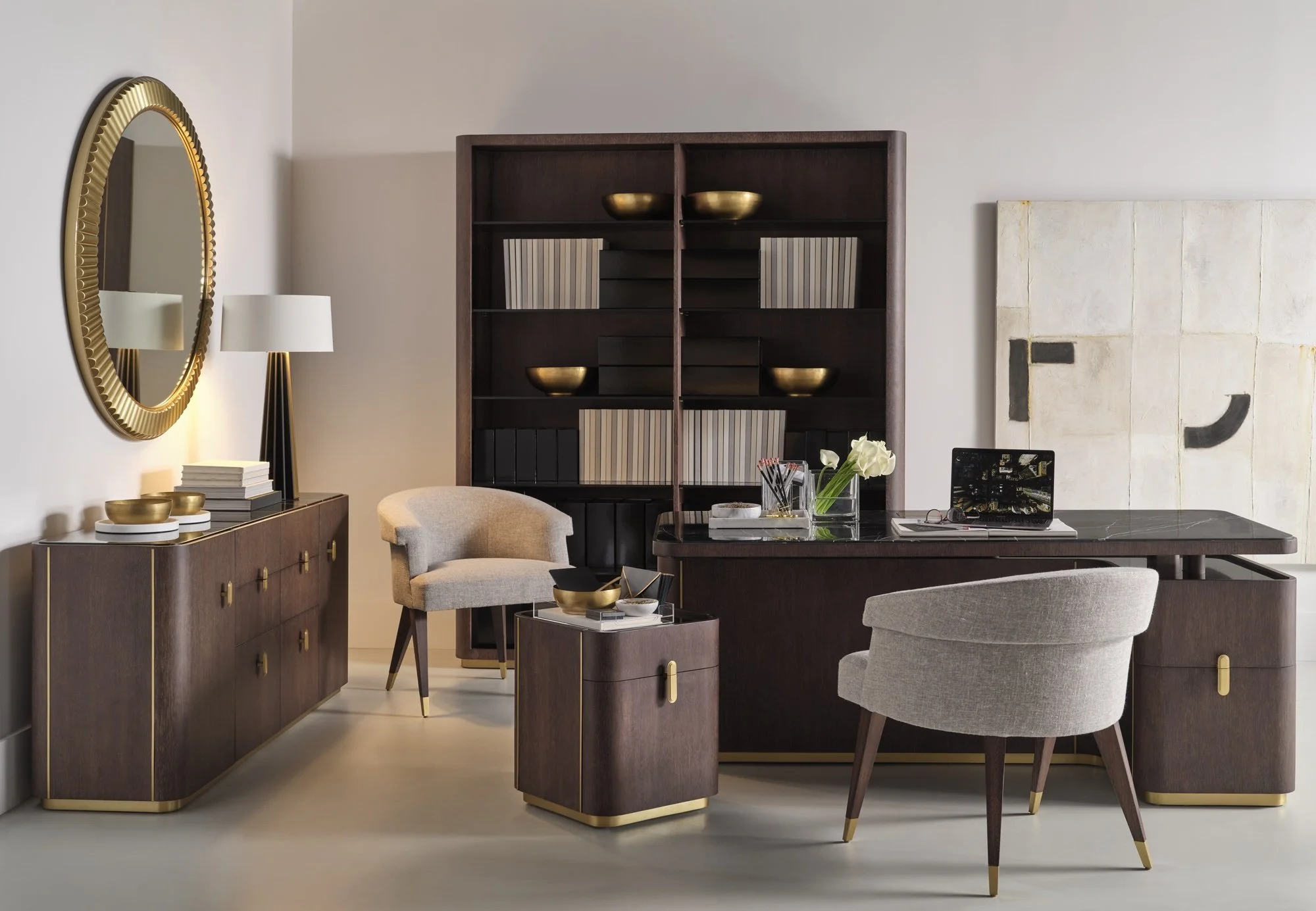 A study composed in dark walnut, brass and pale upholstery — restrained, materially considered